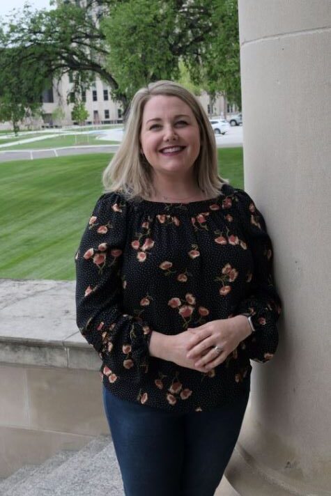 image of woman standing outside on college campus