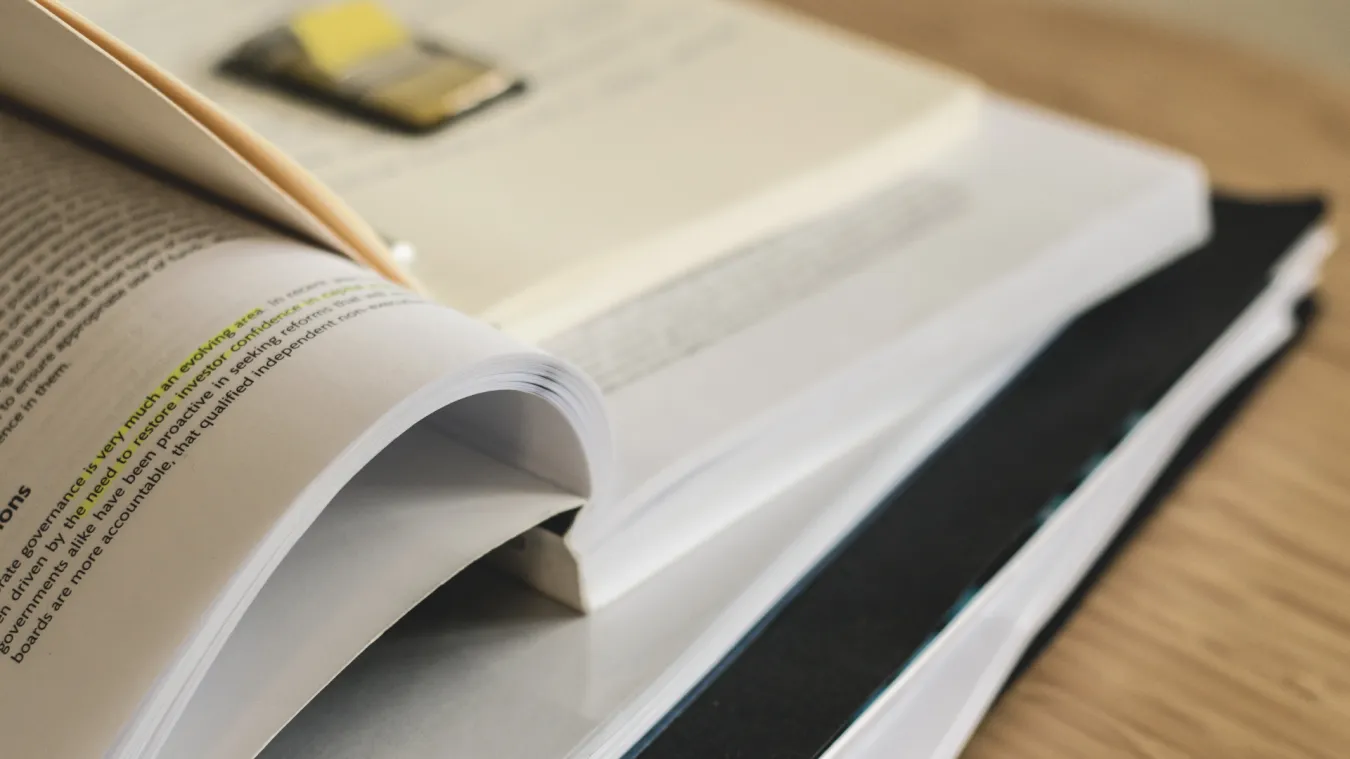 stack of books on a desk