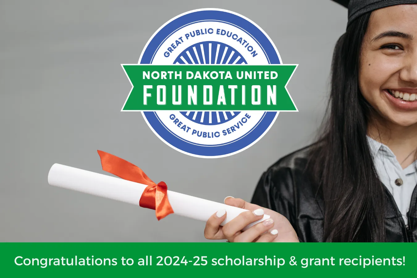 Graduate holding diploma with NDU Foundation logo