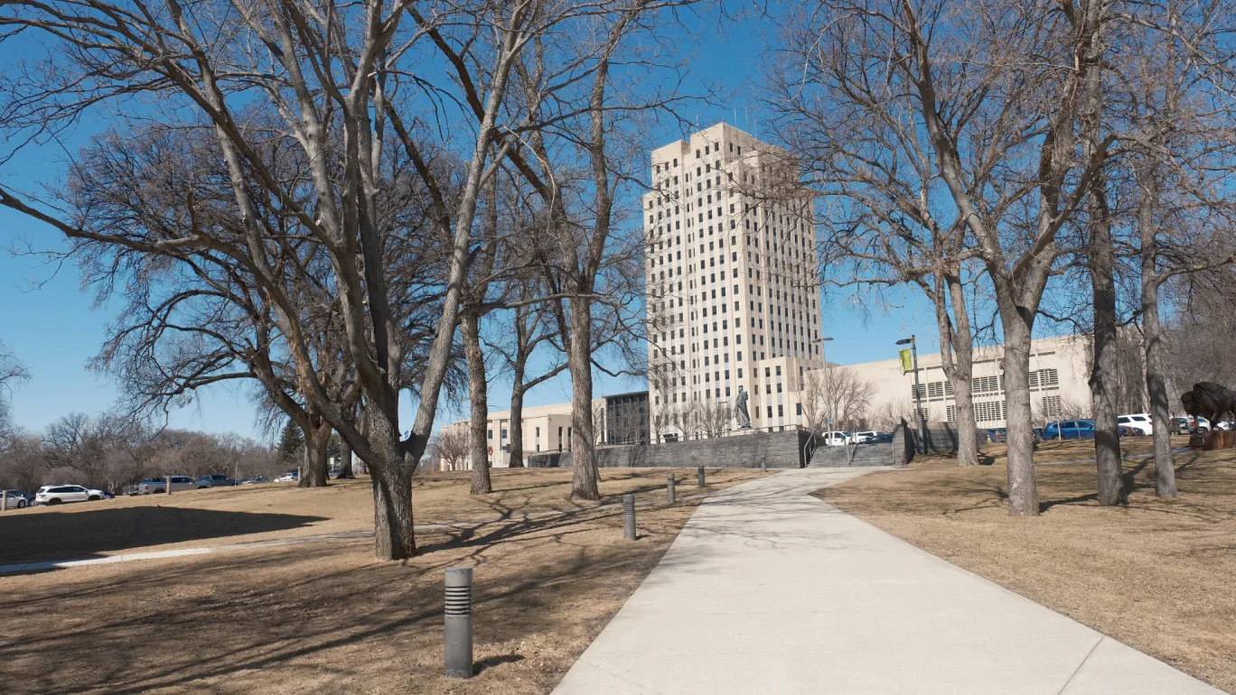 nd capitol with leafless trees in the spring
