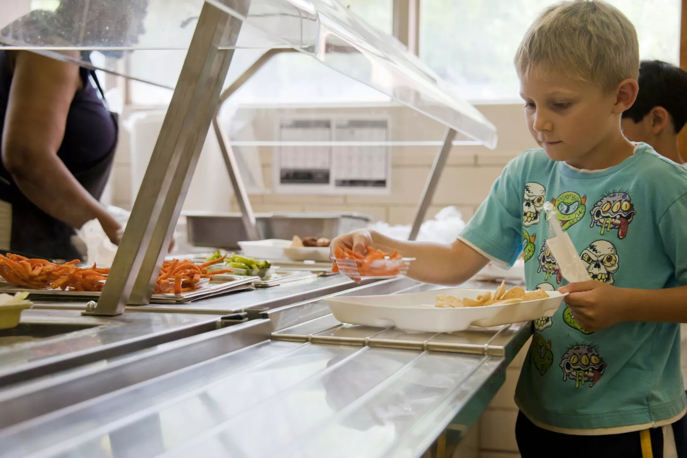Student going through lunch line at school