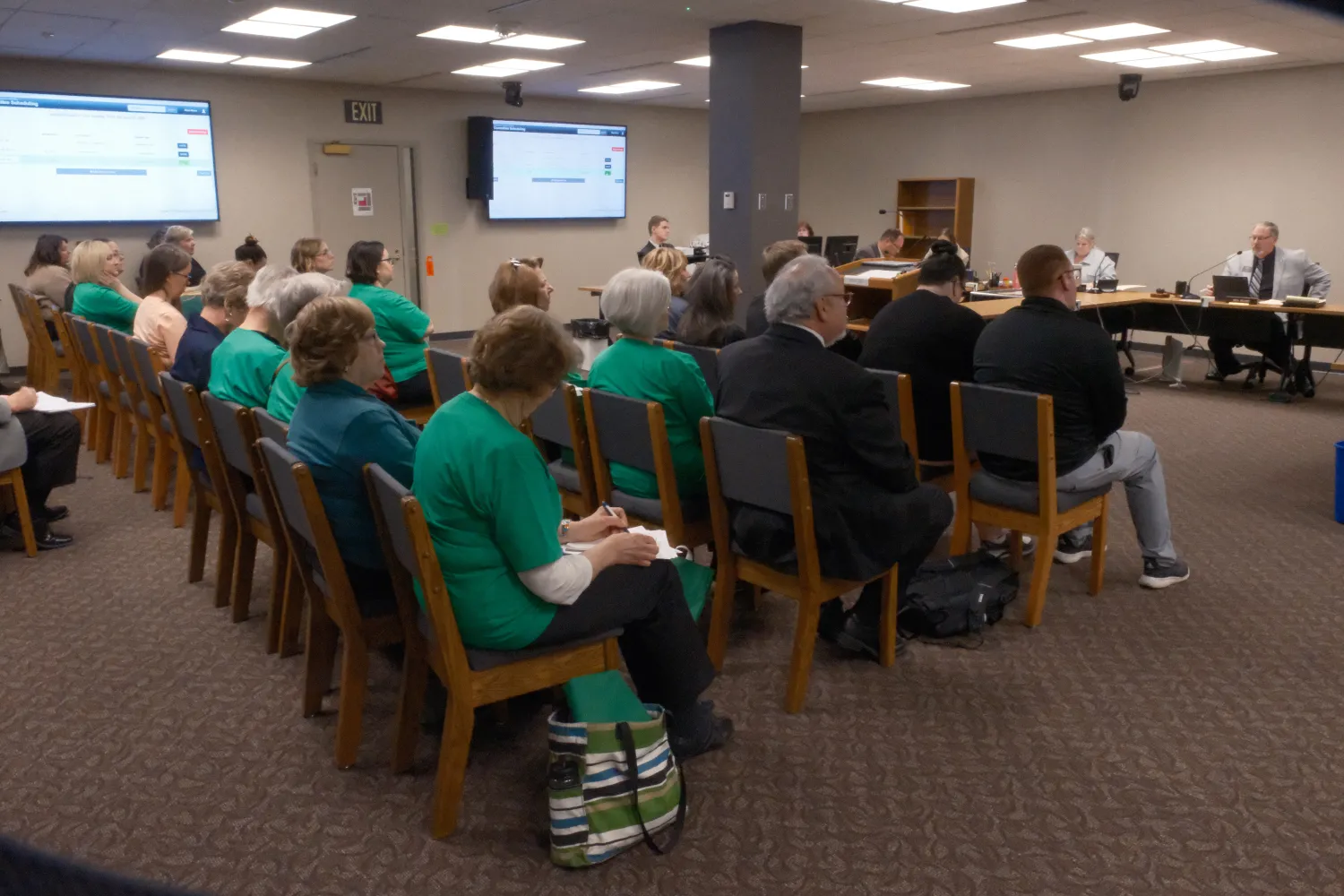 group of people sitting in ND house education committee meeting