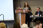 woman speaking at a podium