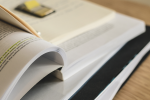 stack of books on a desk