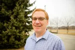 North Dakota United Vice President for Public Employees Gary Feist standing outside.