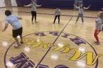 group of students playing in a school gym