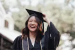 woman wearing graduation cap and gown