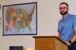 History teacher Landen Schmeichel looks out at his class from behind a podium at Legacy High School in Bismarck.