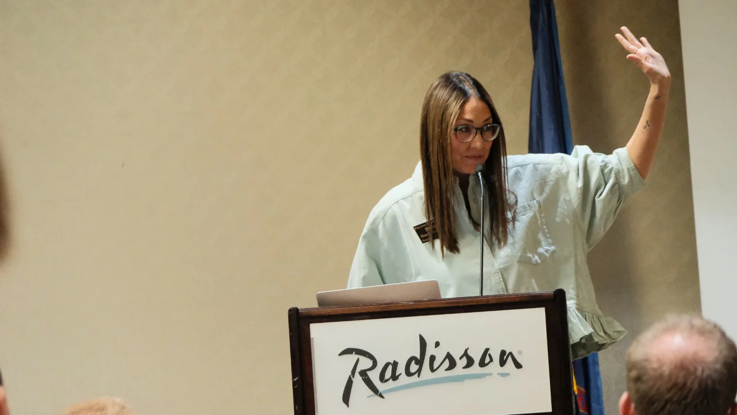 2026 North Dakota Teacher of the Year Frannie Tunseth speaks from the podium during the North Dakota United Delegate Assembly.