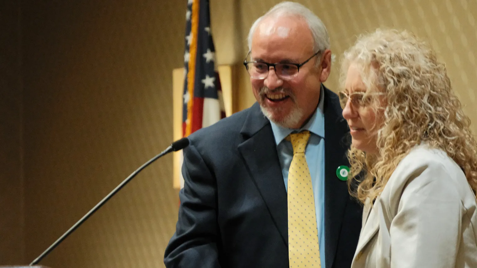 North Dakota United President Nick Archuleta congratulates Dawn Ressler after announcing her as the 2027 Education Support Professional of the Year.