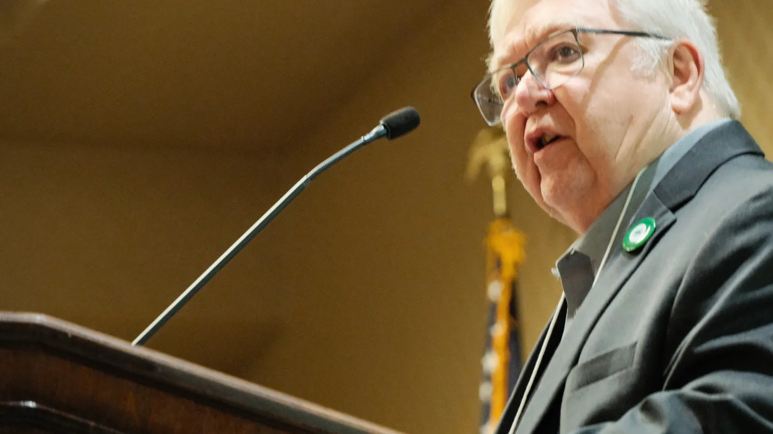 Gary Rath addresses delegates from the podium during the 2026 North Dakota United Delegate Assembly.