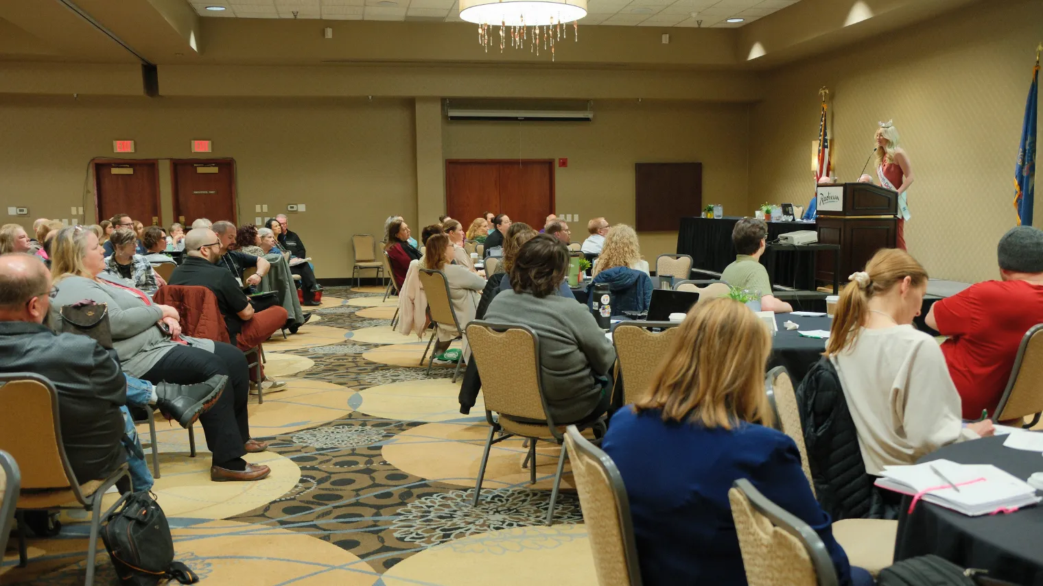 Delegates gather in the ballroom during the 2026 North Dakota United Delegate Assembly as a speaker addresses the audience.