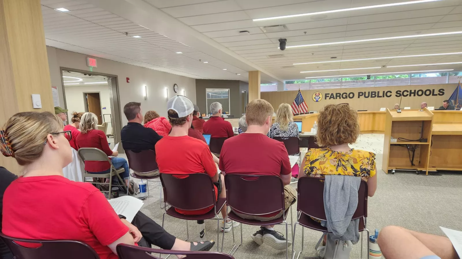 group of people sitting in bargaining meeting