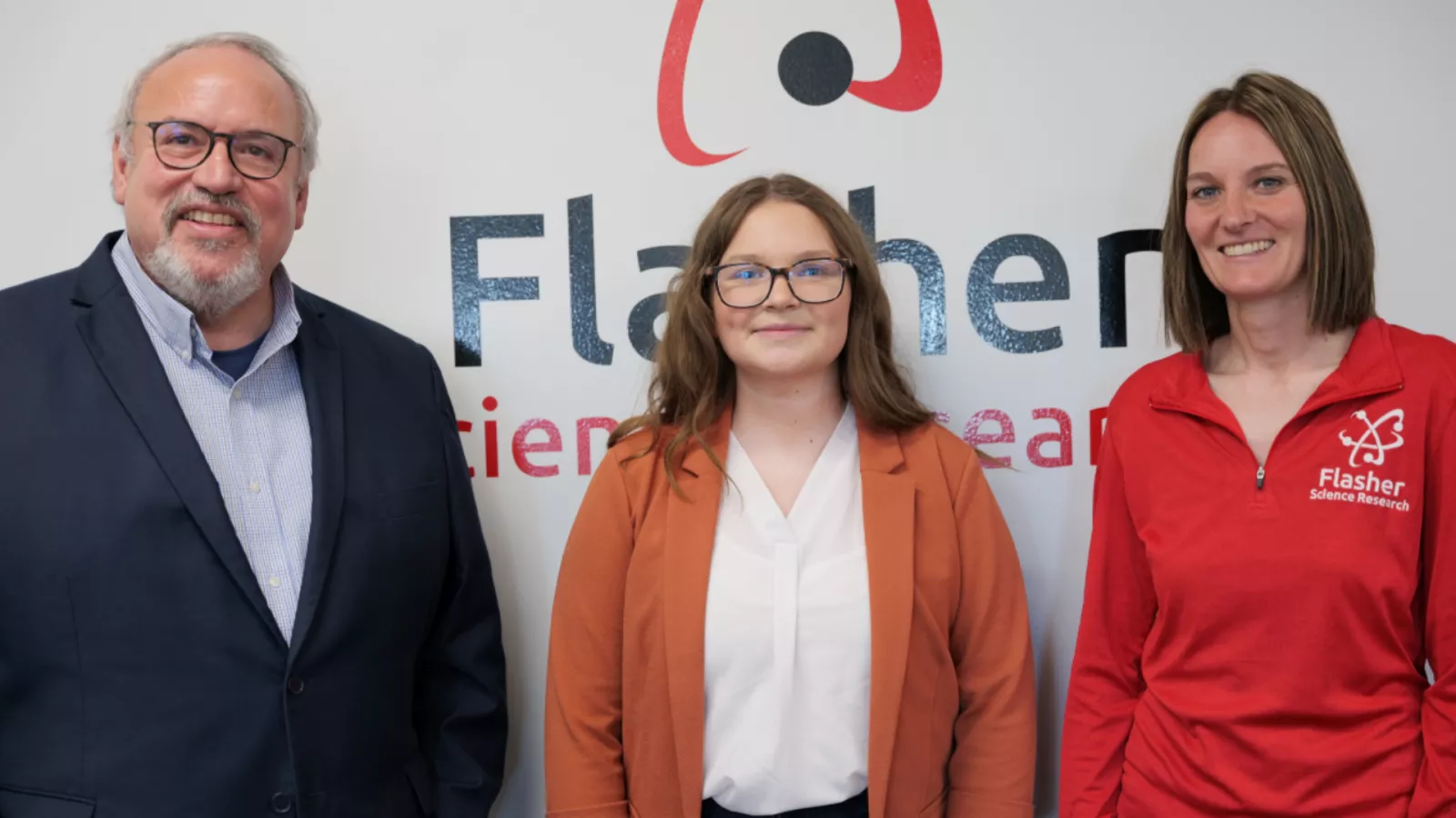 NDU President standing with student and female educator