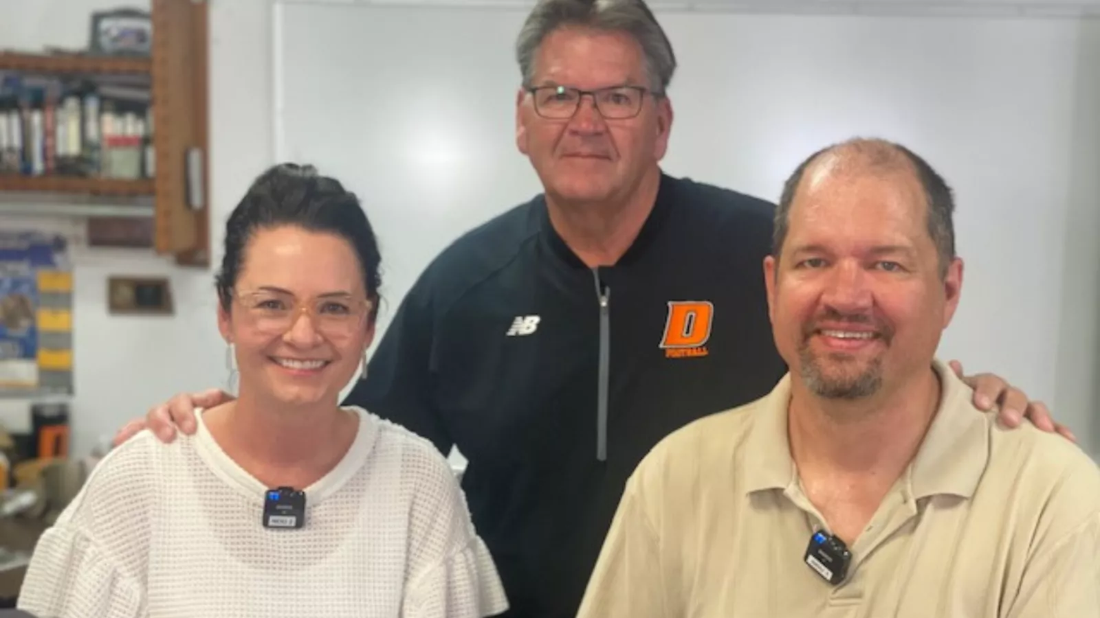 Cara Heiser, Dave Michaelson, and Karl Leggate of DEA pose for a photo in a classroom.