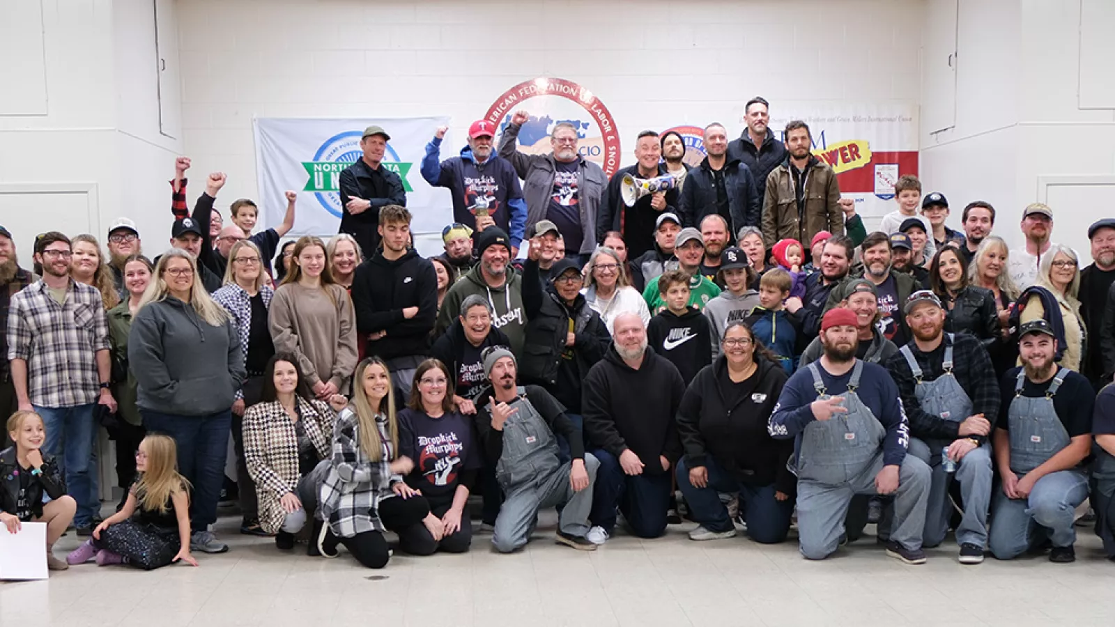Group of 80 North Dakota AFL-CIO members and the band Dropkick Murphys together in a group photo at Fargo labor hall.