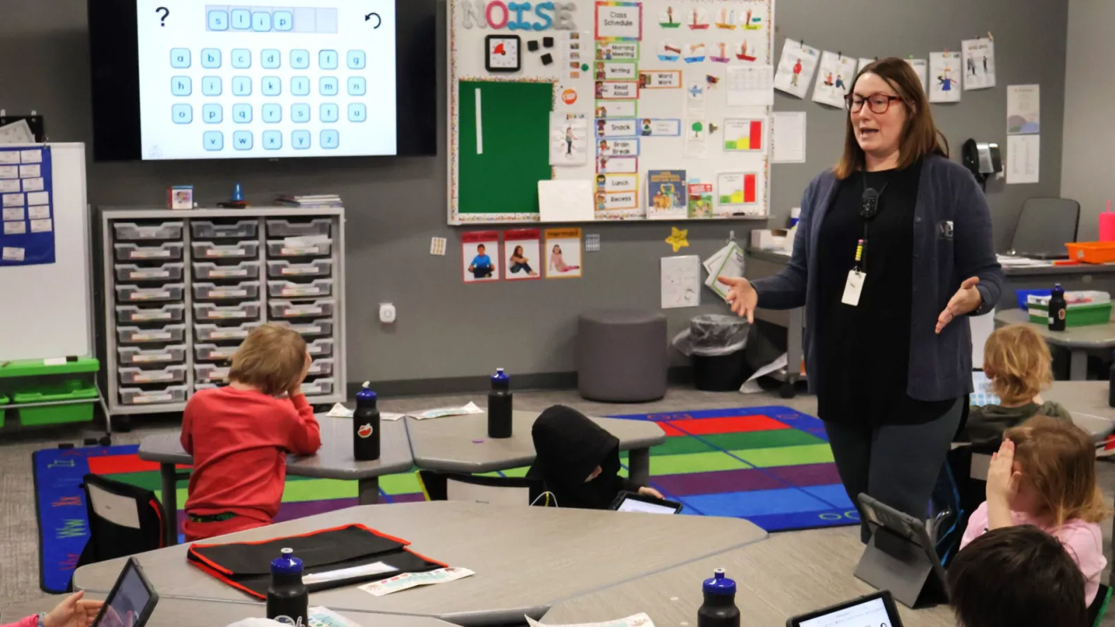 teacher standing in front of elementary class
