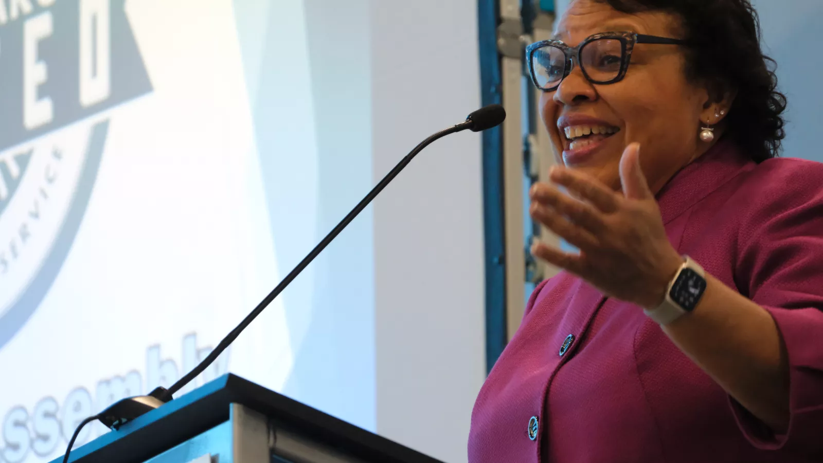 woman standing at podium