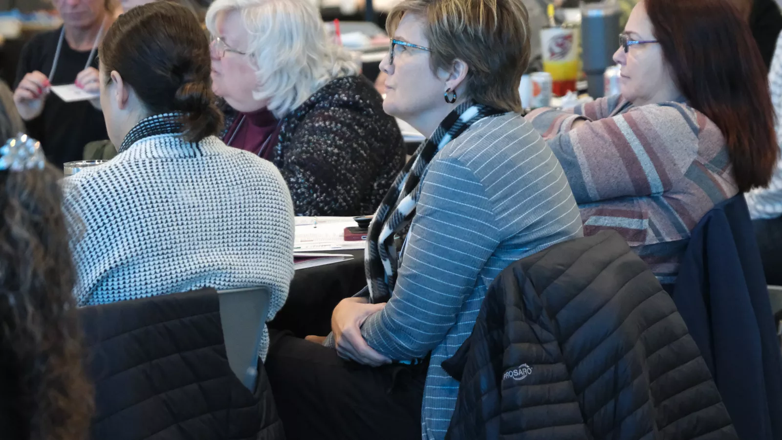 group of women sitting in a audience at a conference