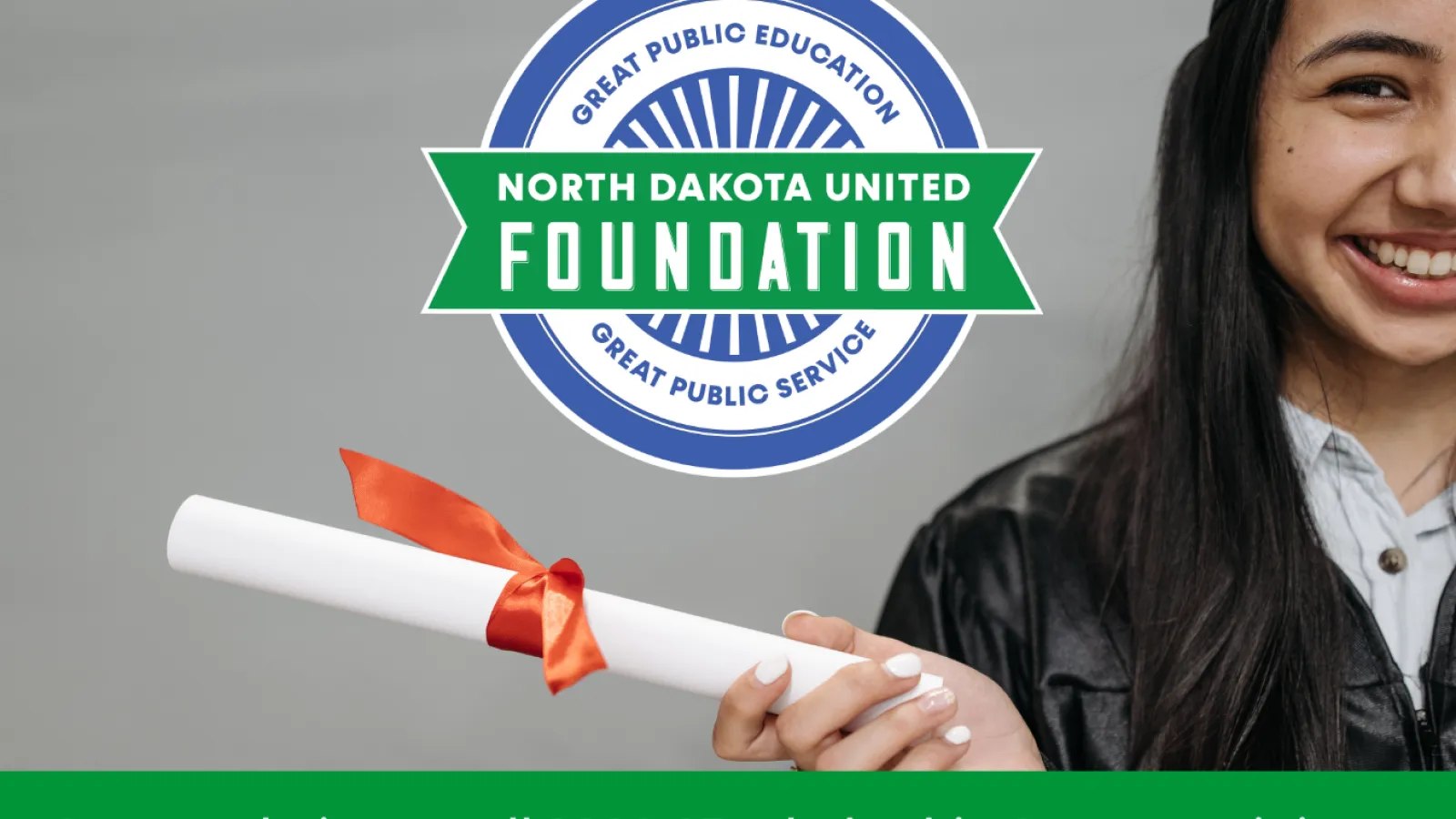 Graduate holding diploma with NDU Foundation logo