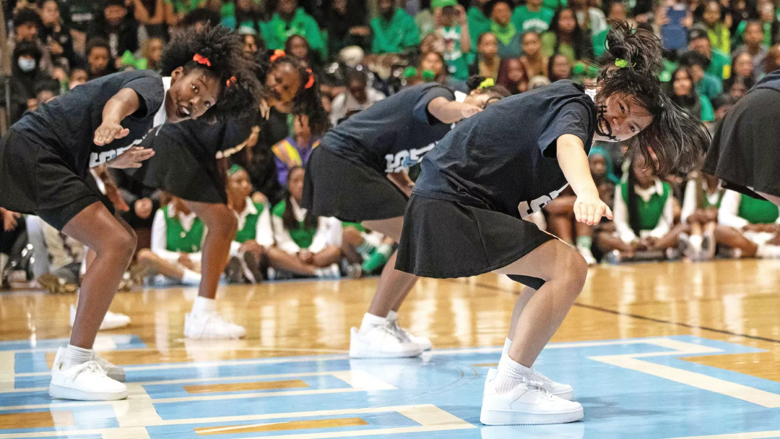 The Lady Raiders Step Squad performs during a pep rally at their school in Greenbelt, Md.