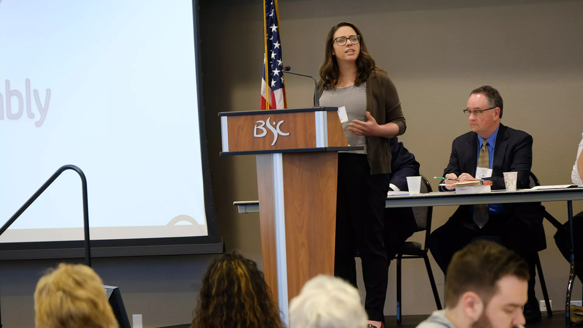 woman speaking at a podium
