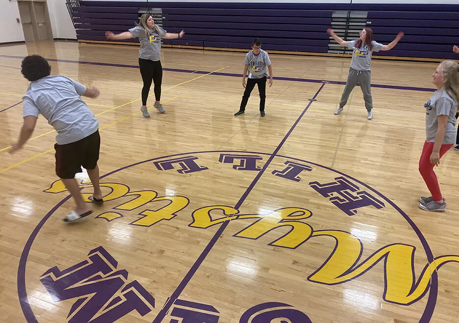 group of students playing in a school gym