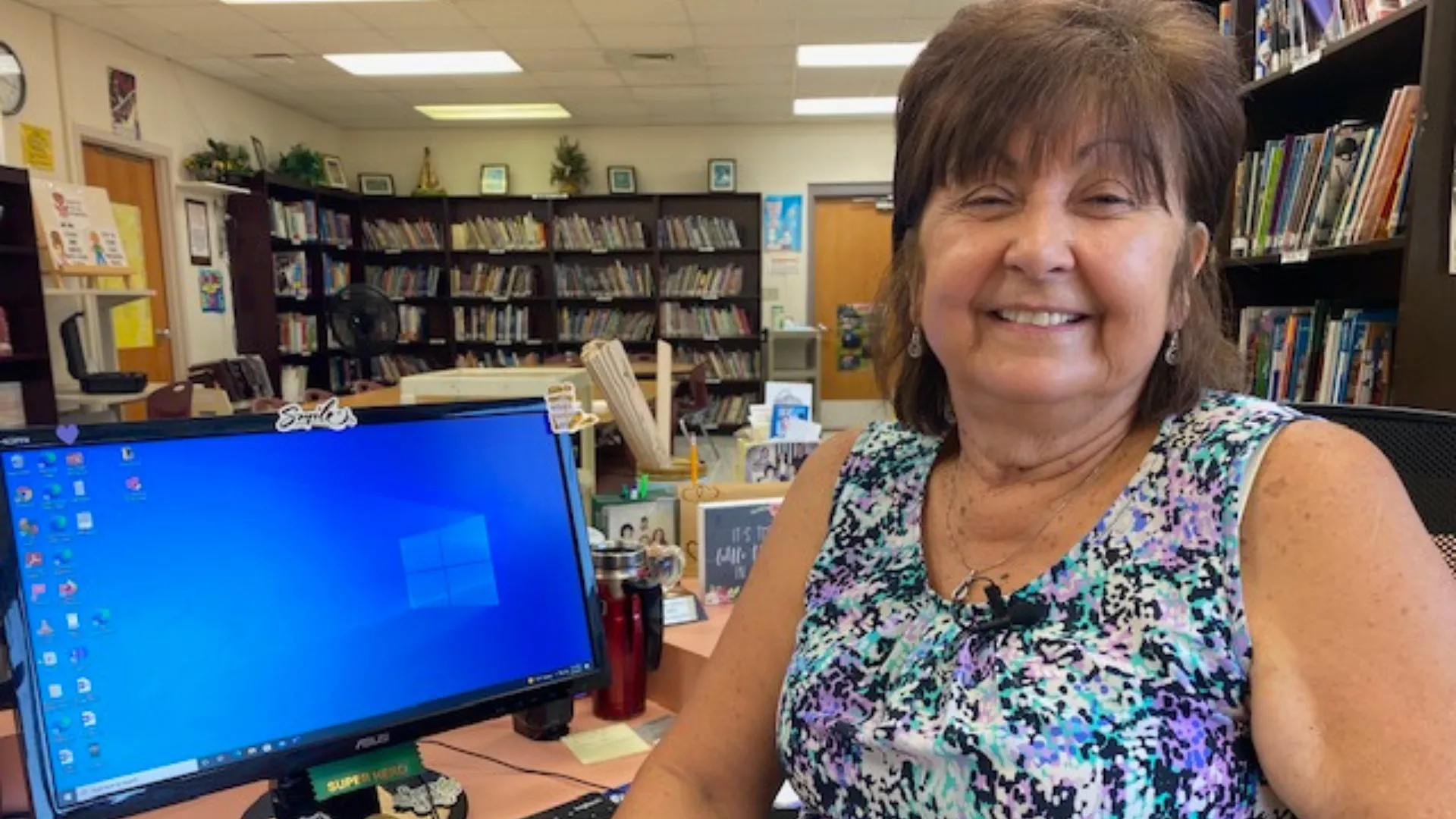 woman sitting next to computer