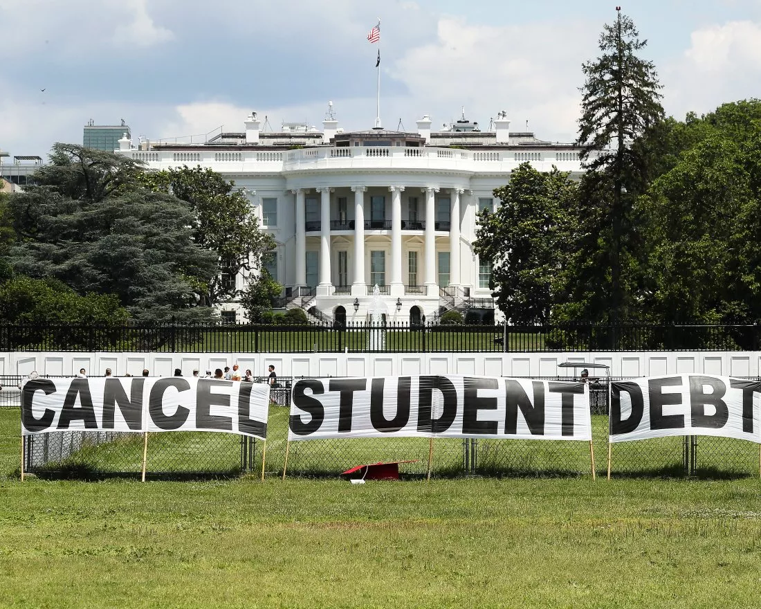 banner outside the white house that says cancel student loan debt