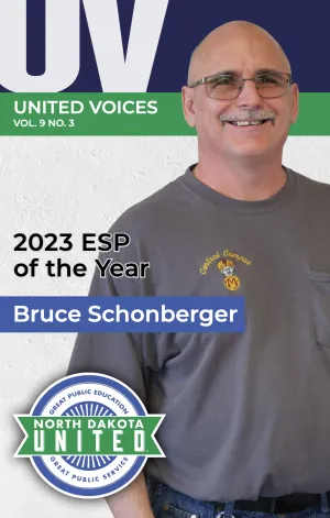 magazine cover with a man wearing a tshirt and glasses