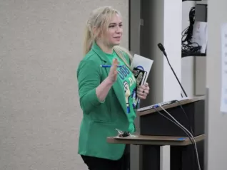 woman speaking at a podium