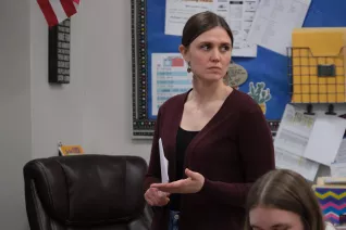 woman standing in classroom