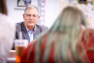 Sen. Randy Lemm listens while a student speaks during Socratic seminar at May-Port CG Middle School.