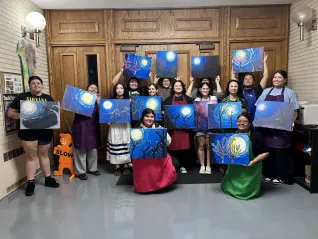 Members of the United Tribes Technical College Student Education Association display paintings they created during a chapter paint night, one of several events designed to build connections among aspiring educators.