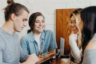 group of college student working at a table