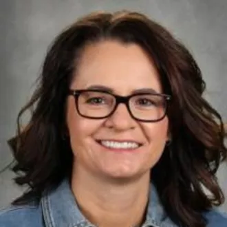 Cara Heiser poses for a school picture day photo.