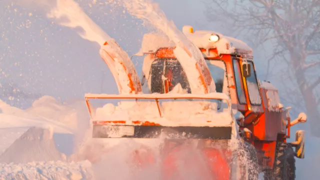 A snow plow moves large amounts of snow