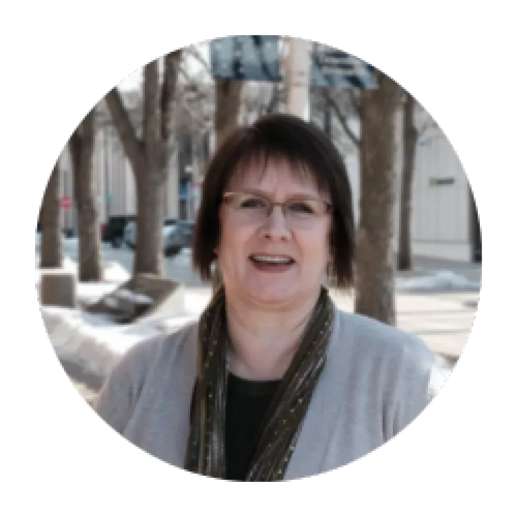 woman with glasses standing outside